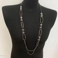Collier sautoir multi-chaînes en acier et perles 